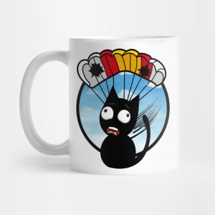 Silly black cat has a broken parachute Mug